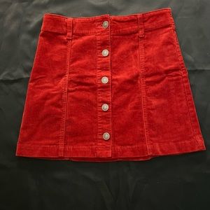 Velvet Orange Colored Skirt. Comfy. Button Up and belt loops.